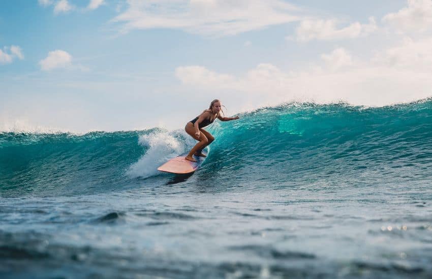 Surfer riding a wave in Belize