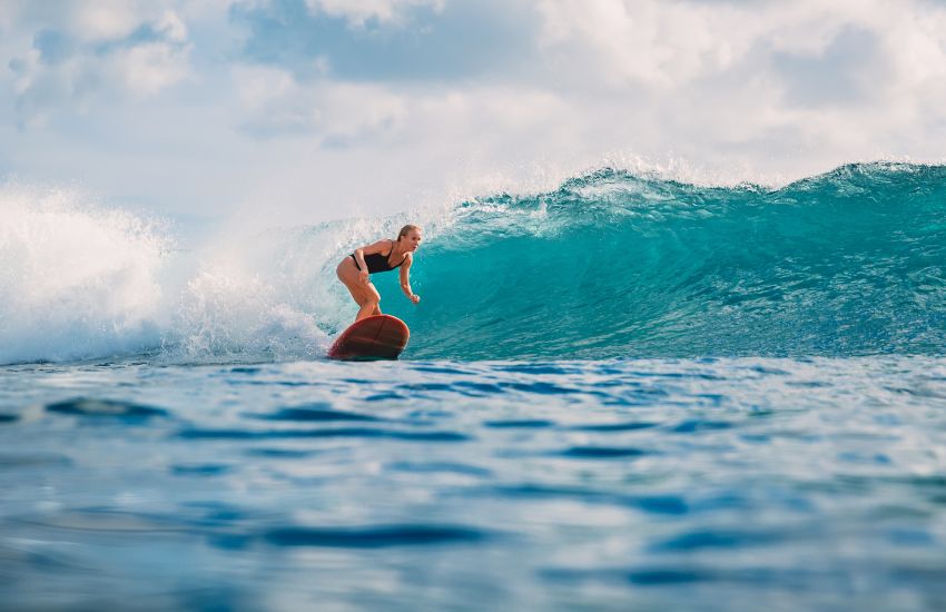 Surfer surfing in Belize