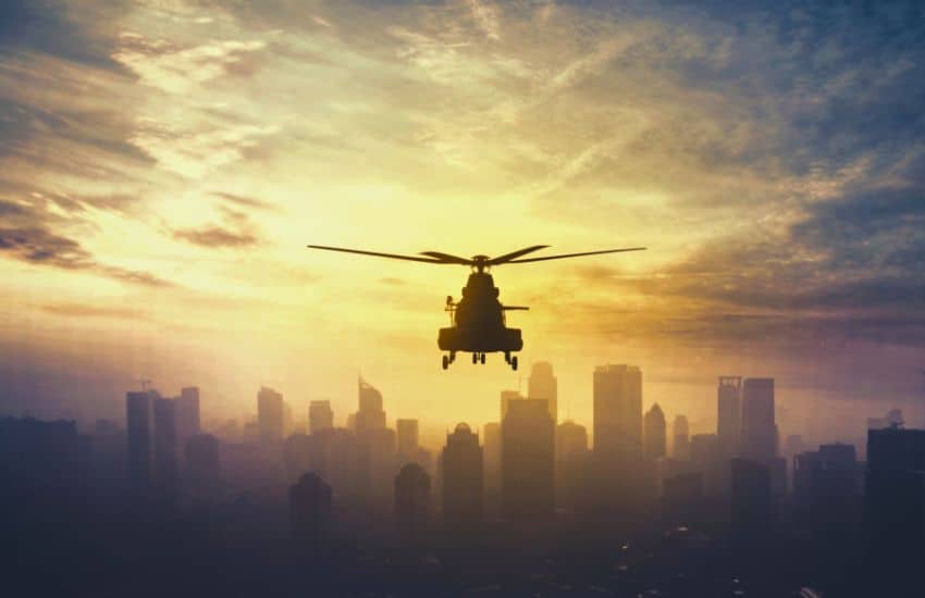 helicopter flying high over a city